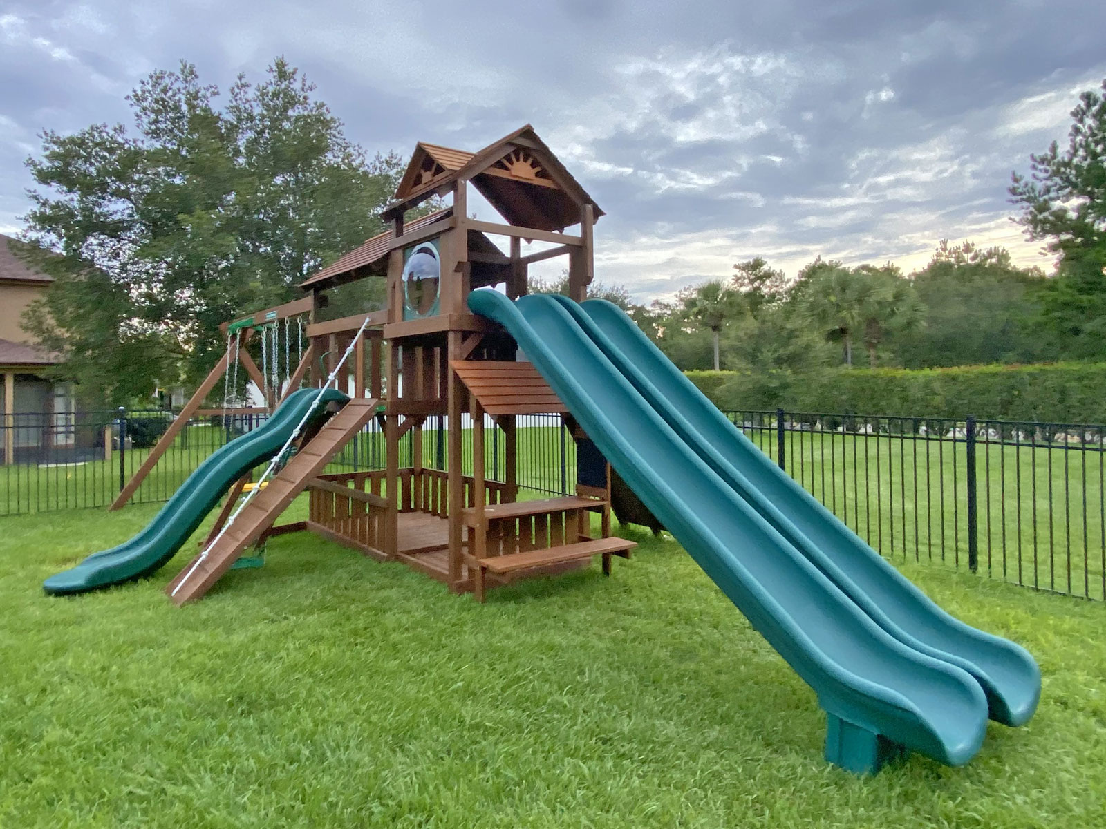 Photo of a Creative Playthings swing set in a customer's yard.
